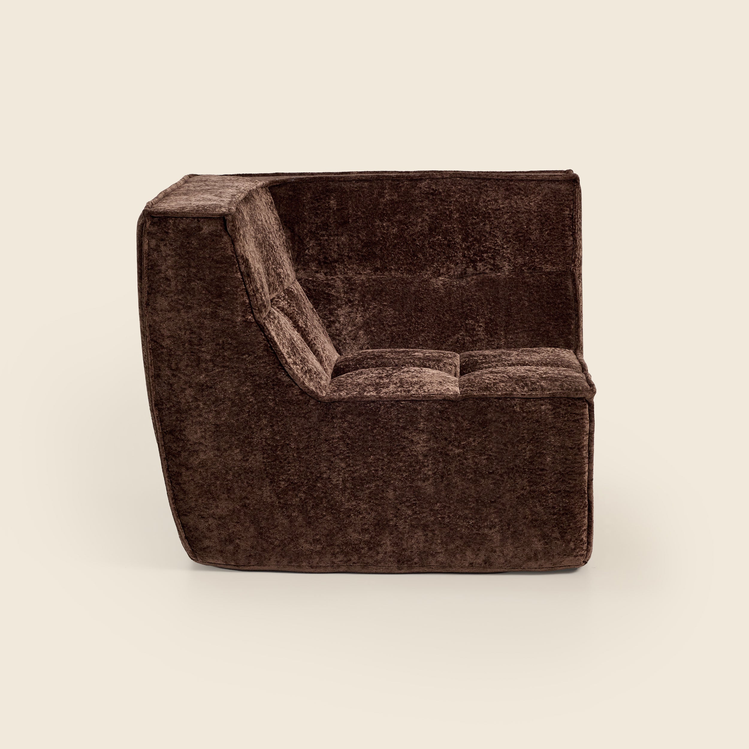 Brown textured armchair on a beige background