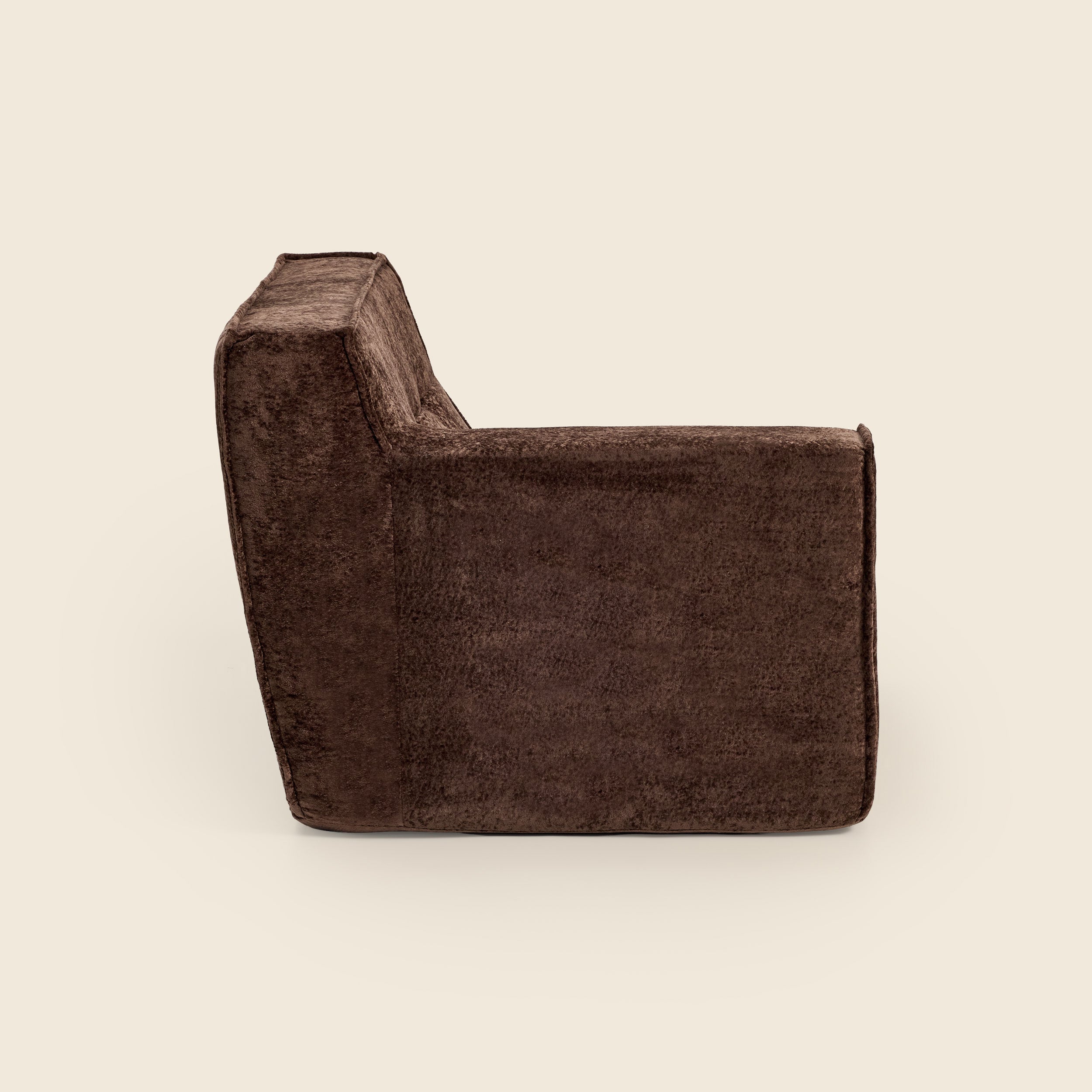 Brown textured arm piece on a beige background