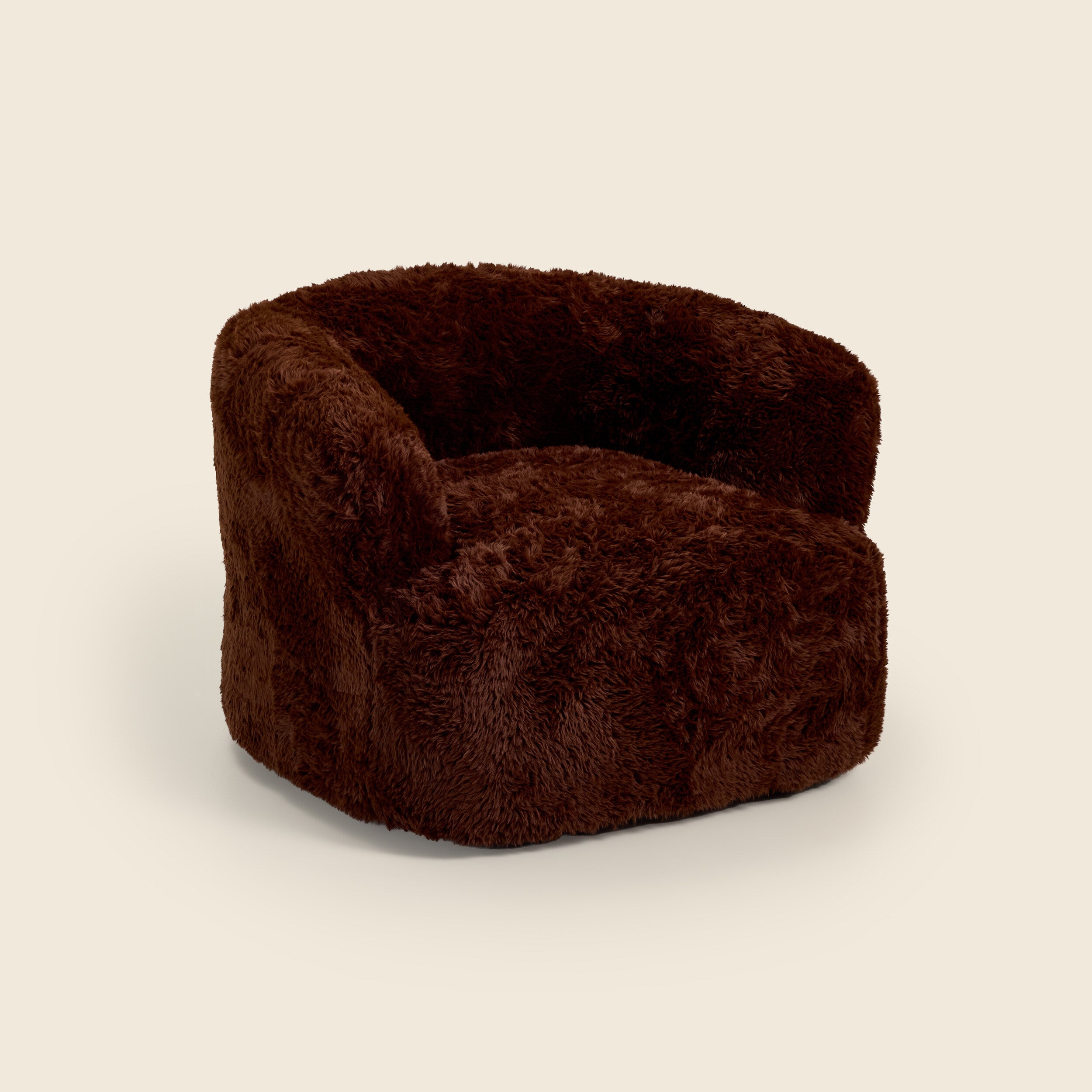 Brown plush armchair on a beige background