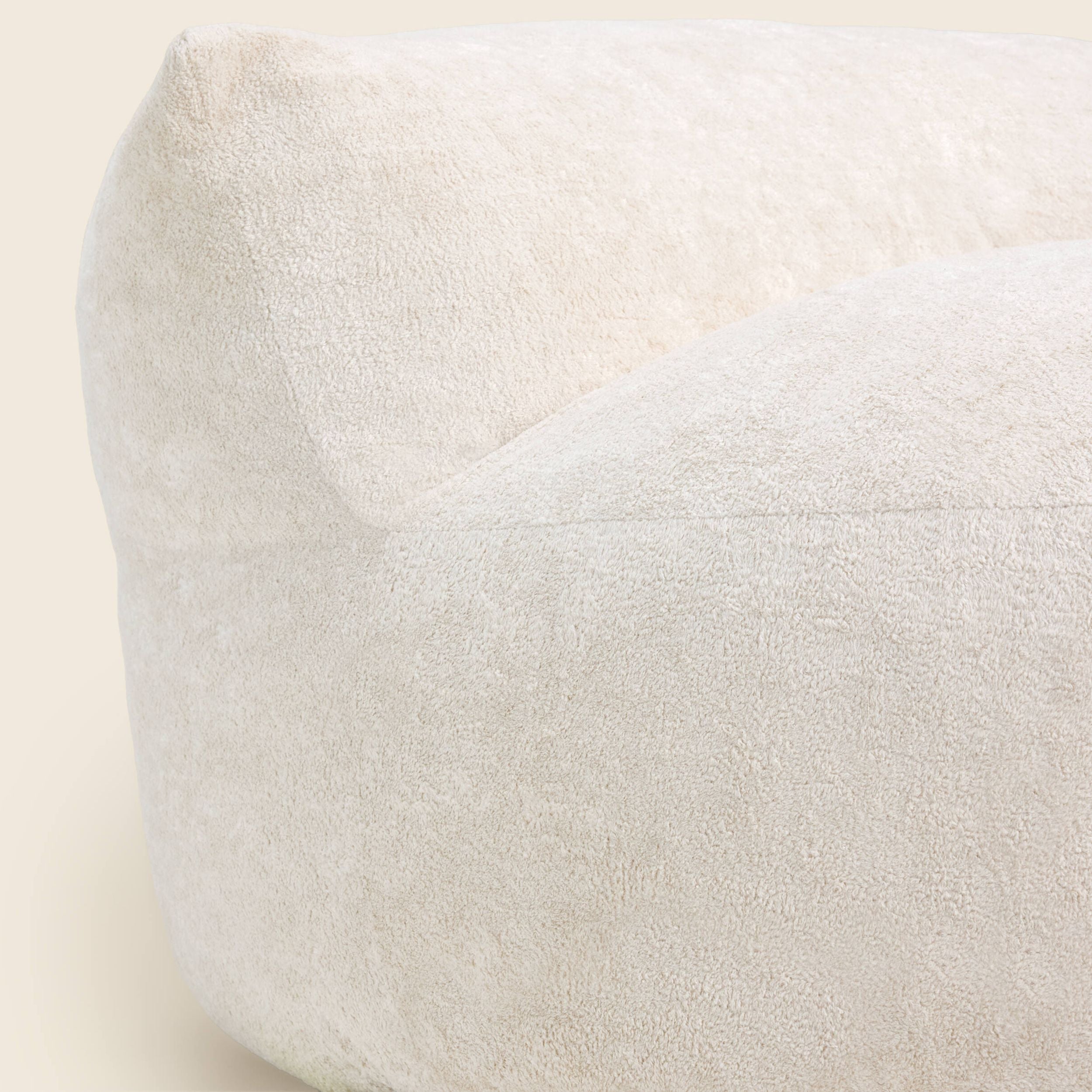 White bean bag chair on a beige background