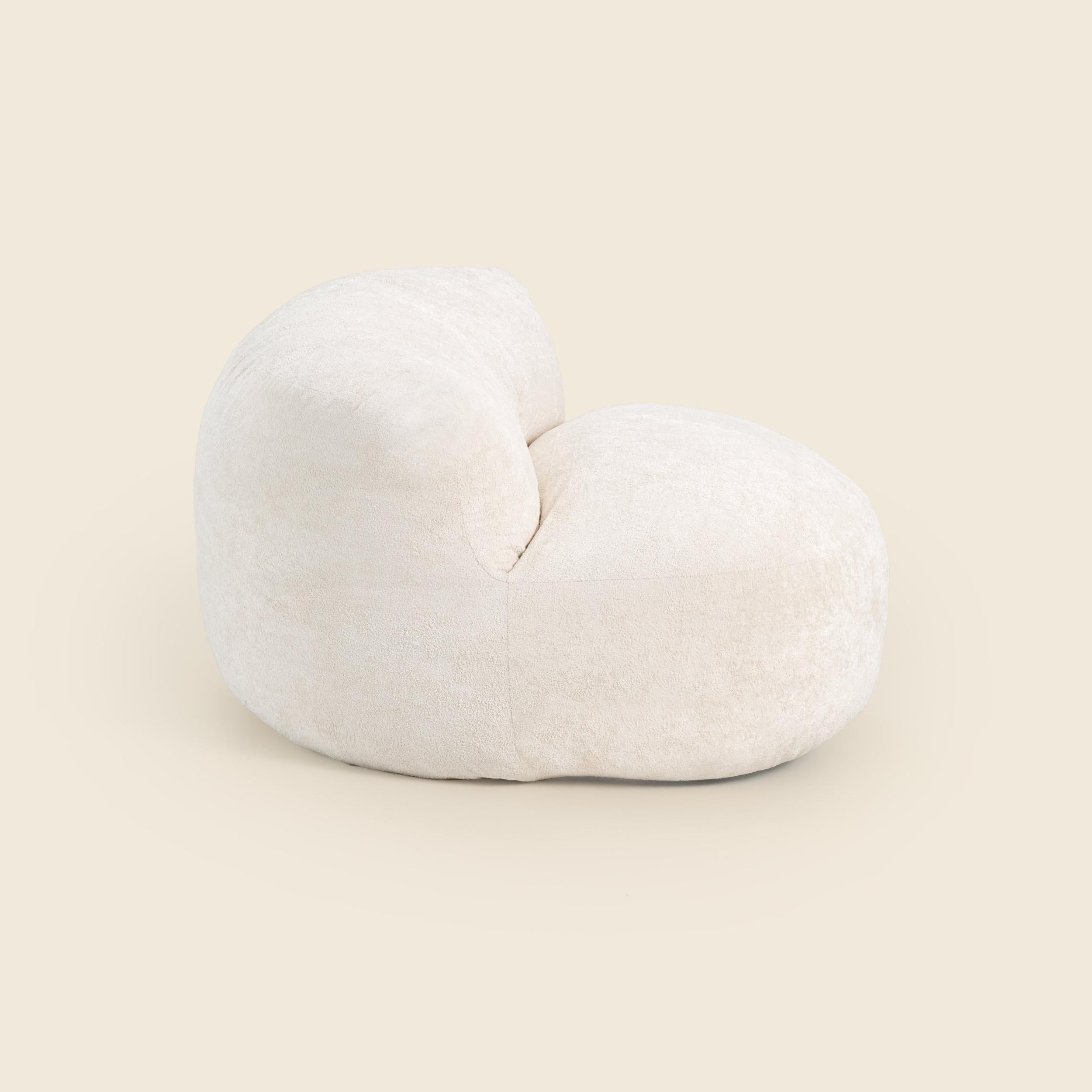 White bean bag chair on a beige background
