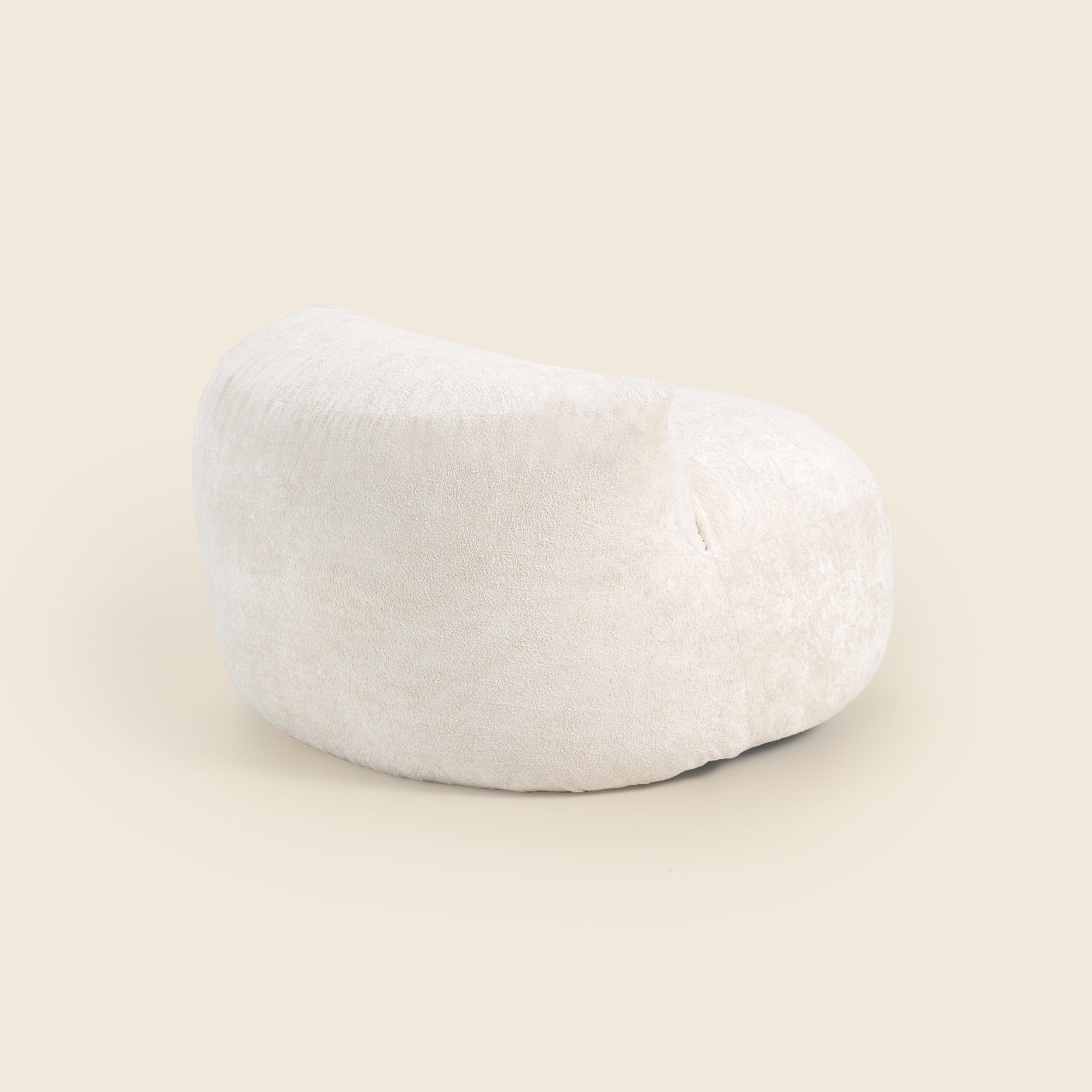 White bean bag chair on a beige background