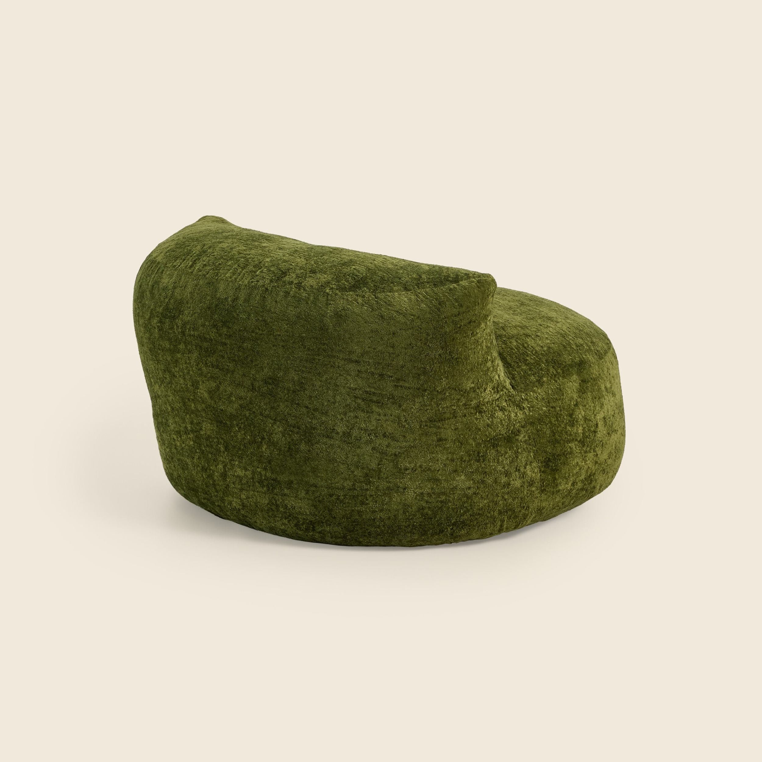 Green textured chair on a beige background