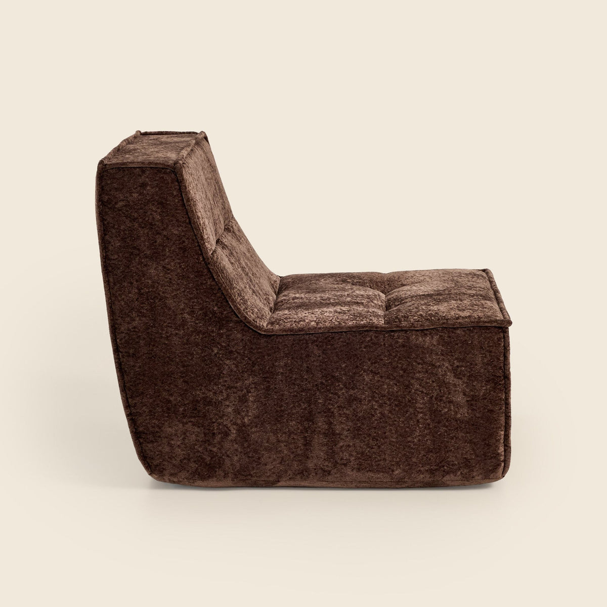 Brown snow velvet Loungi Occasional Chair, side view on a beige background