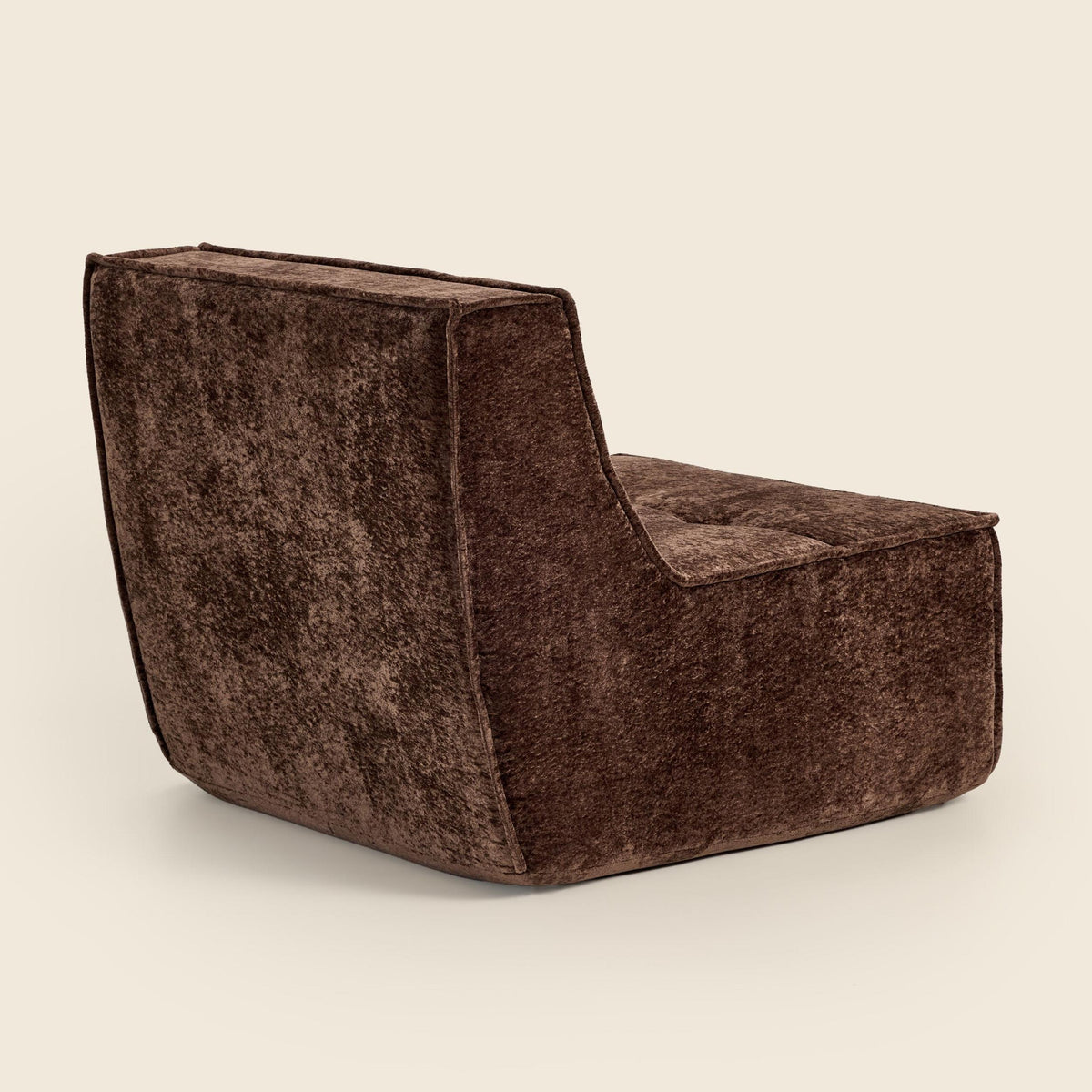 Brown snow velvet Loungi Occasional Chair, back view on a beige background
