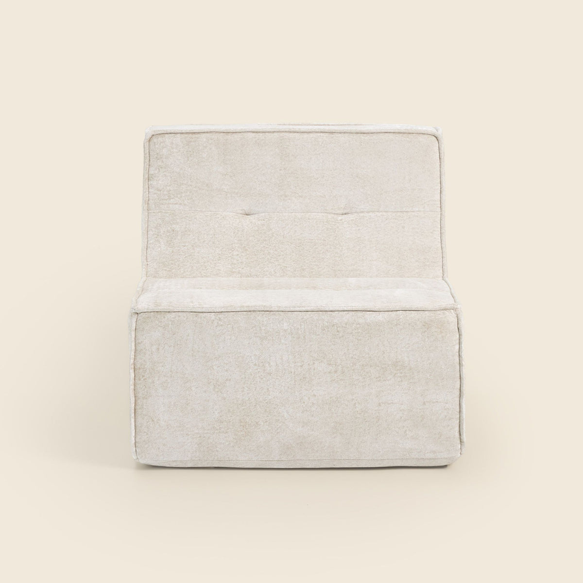 Oat snow velvet Loungi Occasional Chair, angled view on a beige background