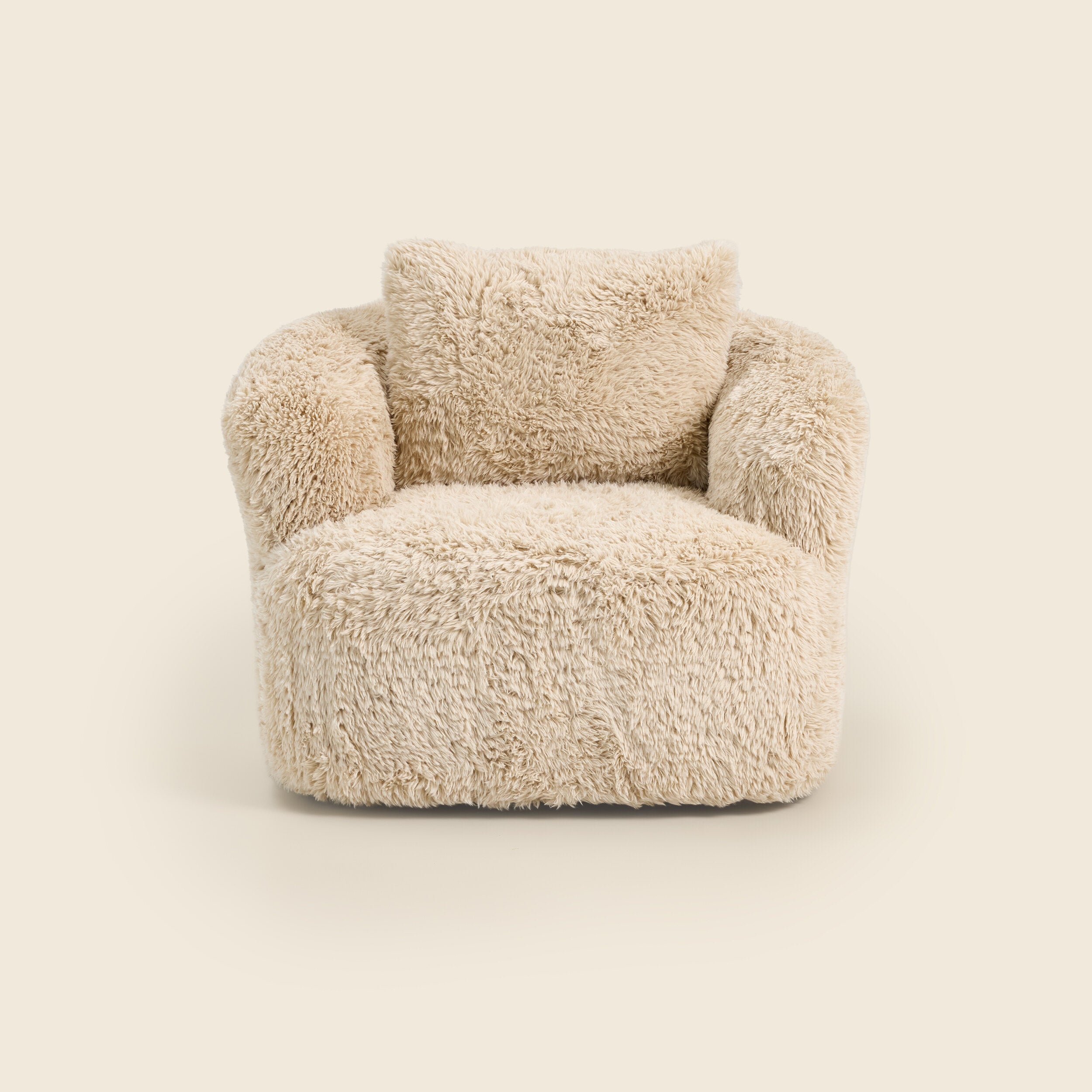 Beige fluffy armchair on a beige background