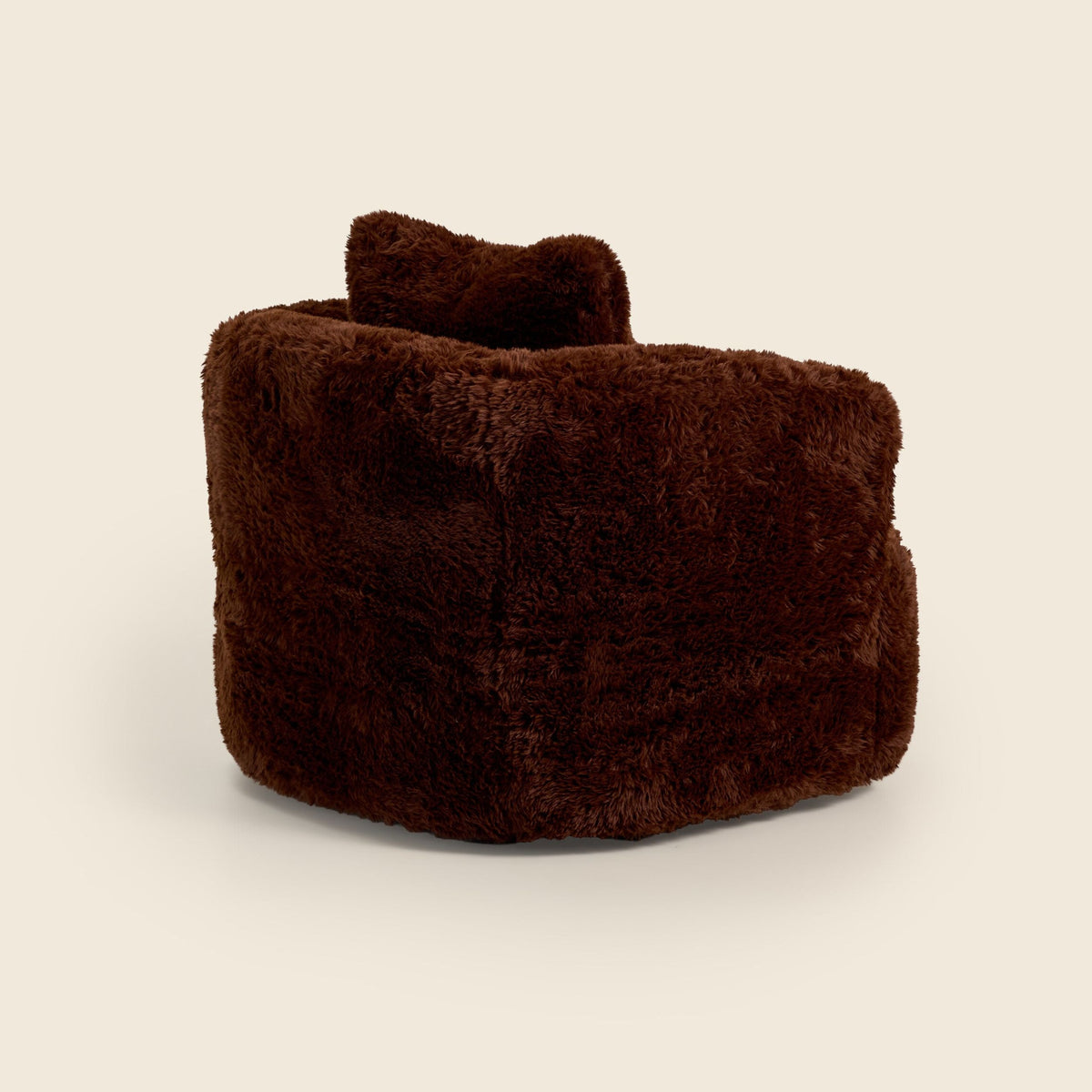 Brown faux fur Peachi Swivel Chair, detail view on a beige background