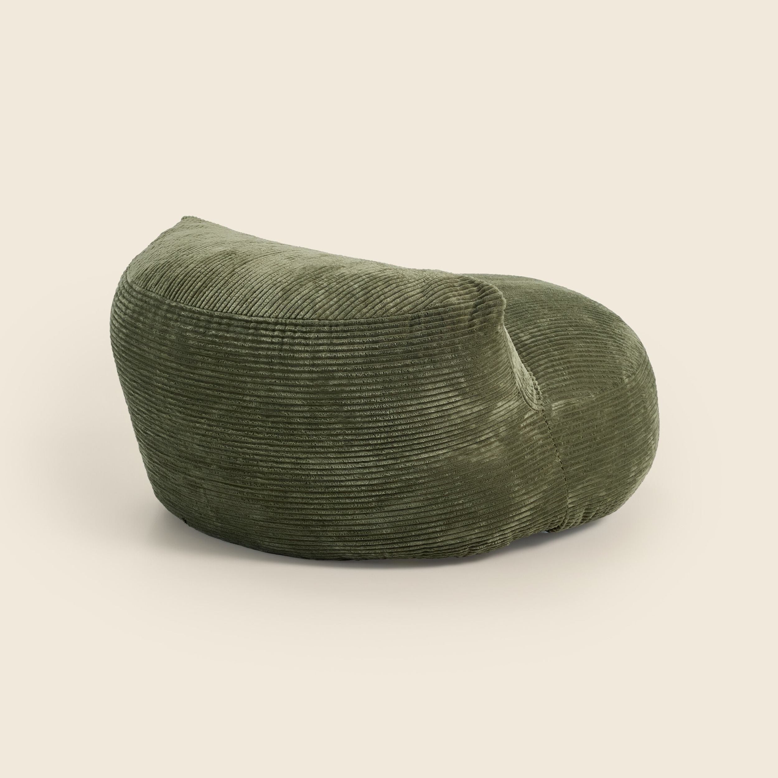 Green bean bag chair on a beige background