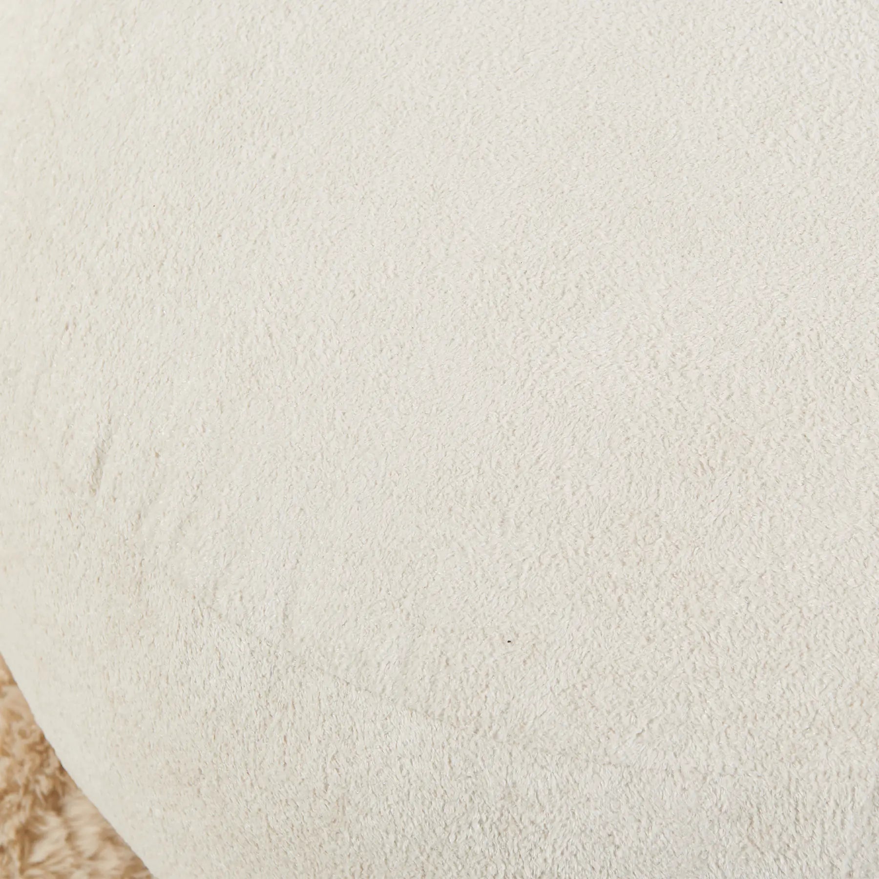 Close-up of a textured beige fabric surface