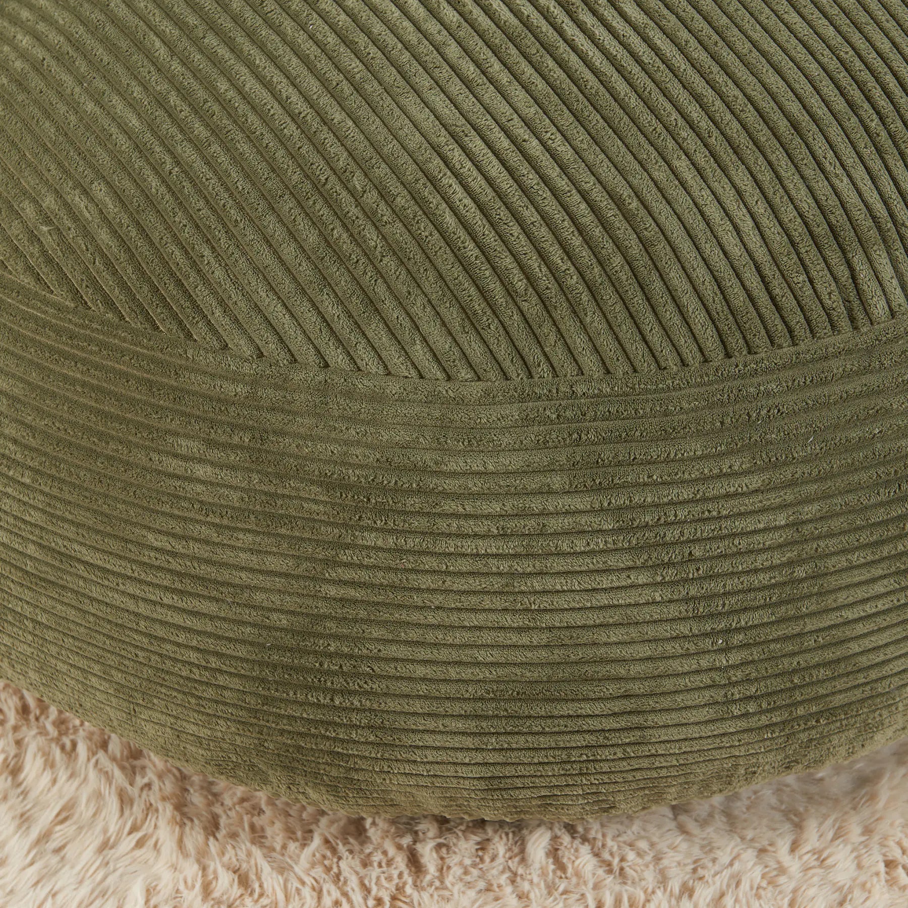 Close-up of a green textured fabric surface