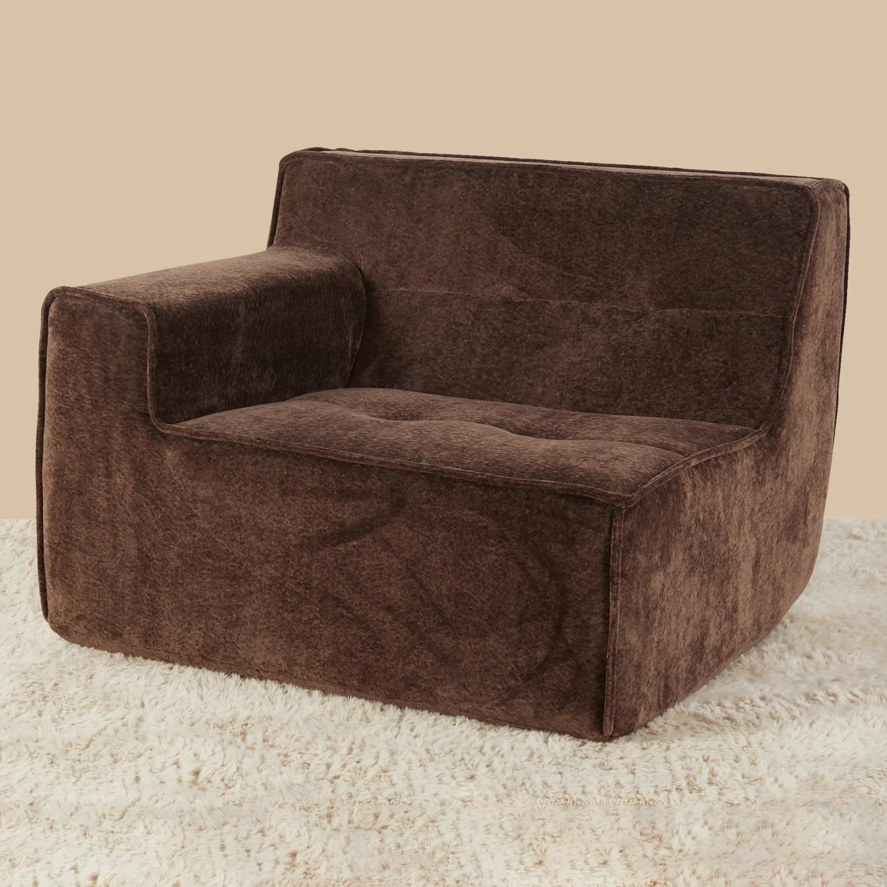 Brown textured armchair on a beige carpet