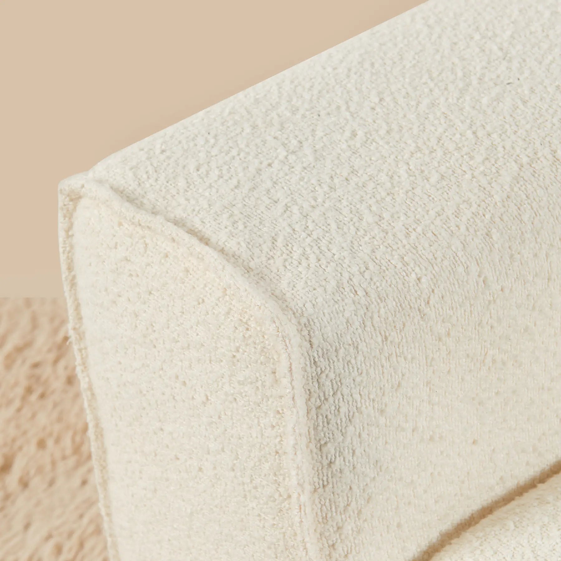 Close-up of a textured white fabric on a beige background