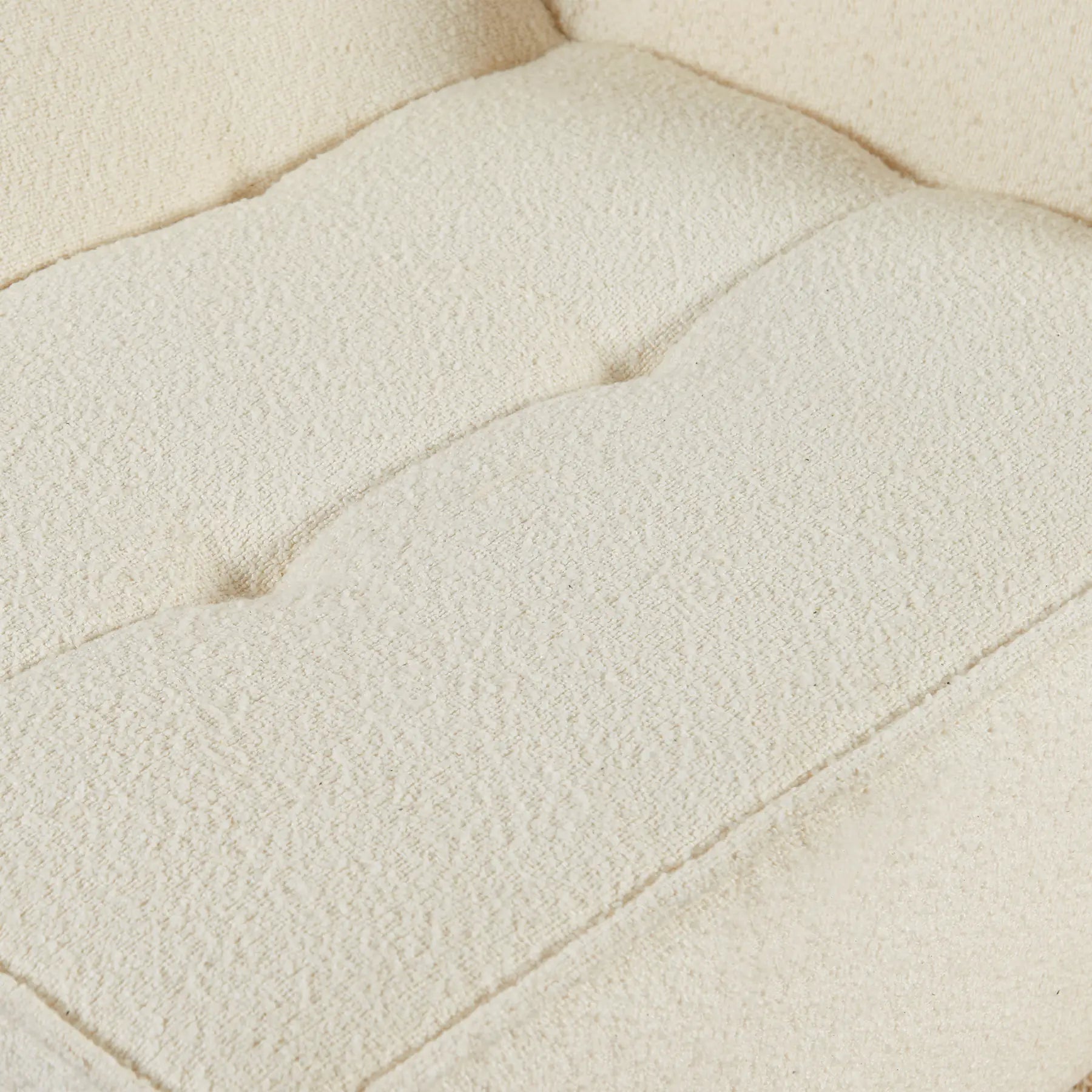 Close-up of a textured beige fabric surface