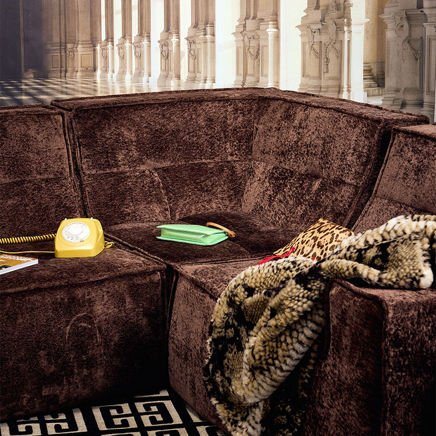 Brown textured modular couch in a palace