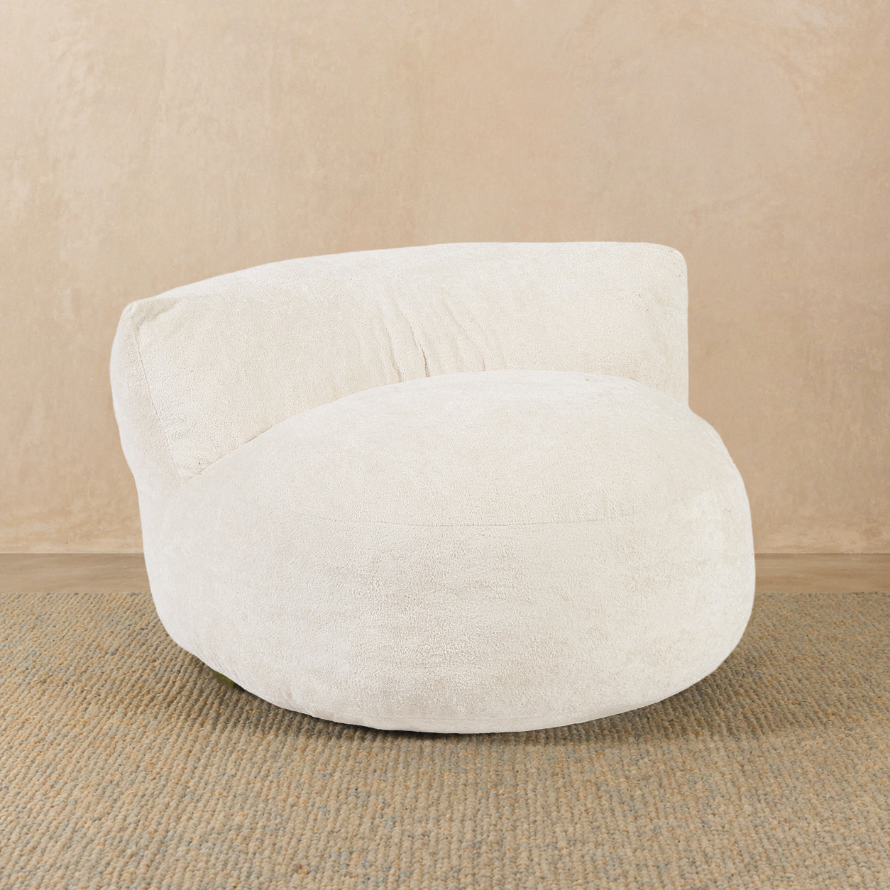 White bean bag chair on a beige background