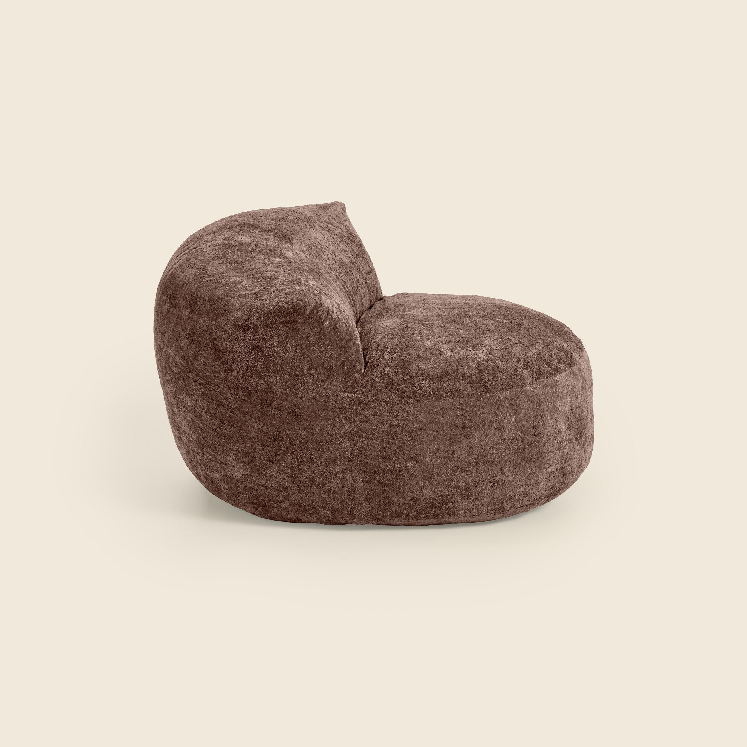 Brown textured bean bag chair beige background