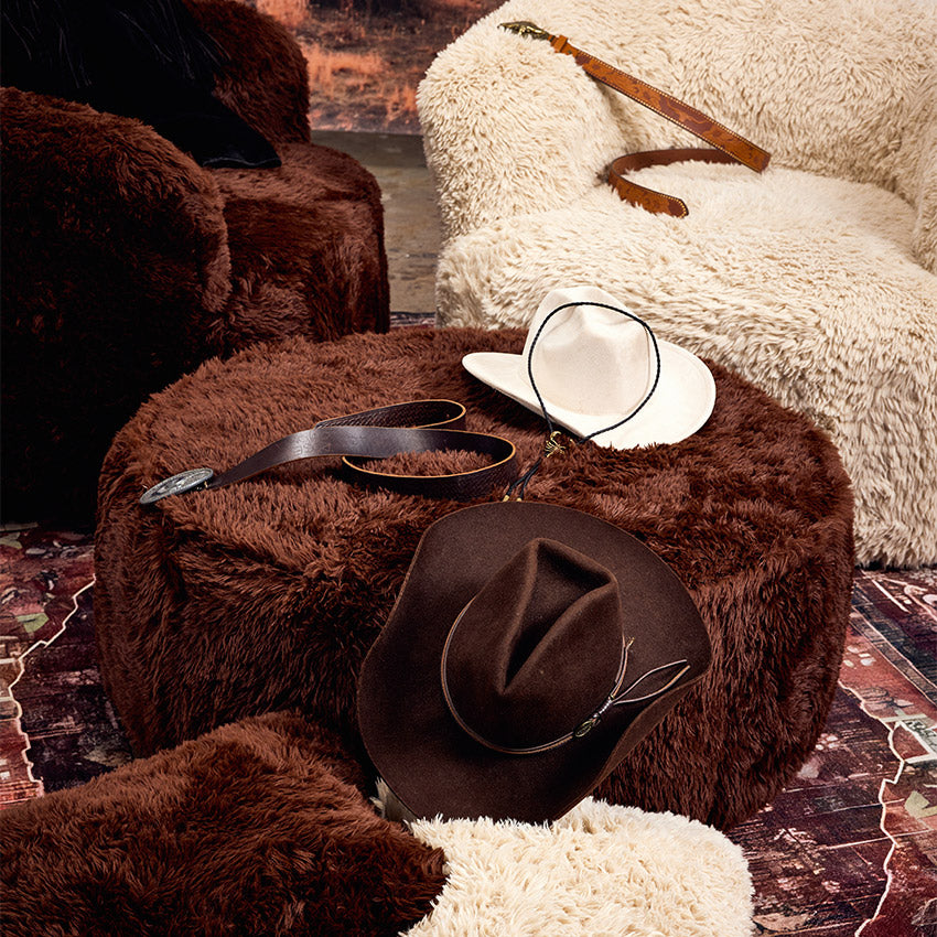 Brown round ottoman in the dessert