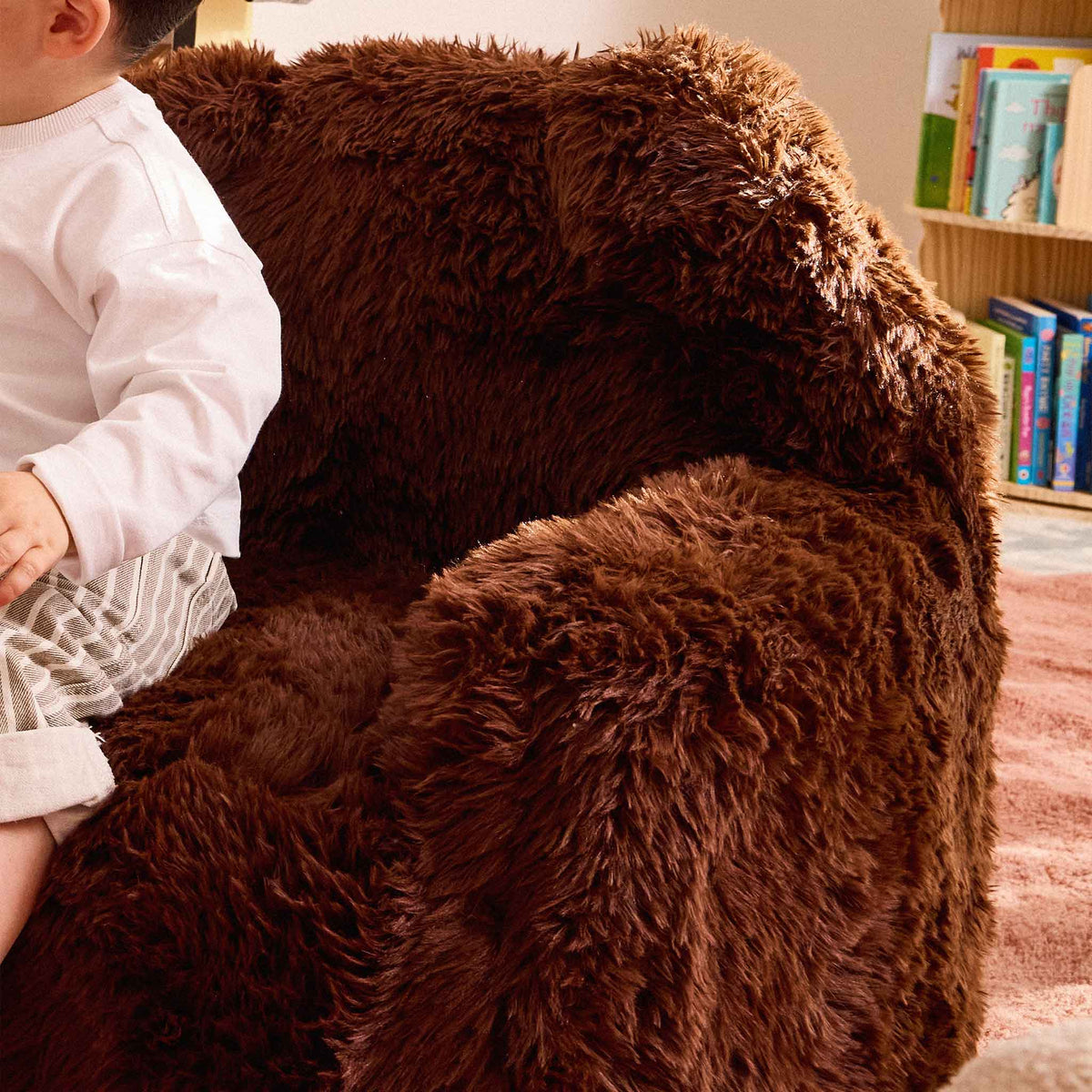 Close-up of the brown faux fur arm and ear of the Beari Kids Armchair