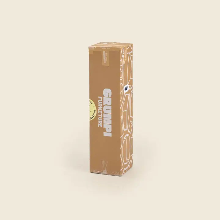 A tall Grumpi box standing on its end, before it is opened