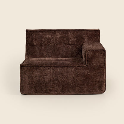 Brown textured armchair on a beige background
