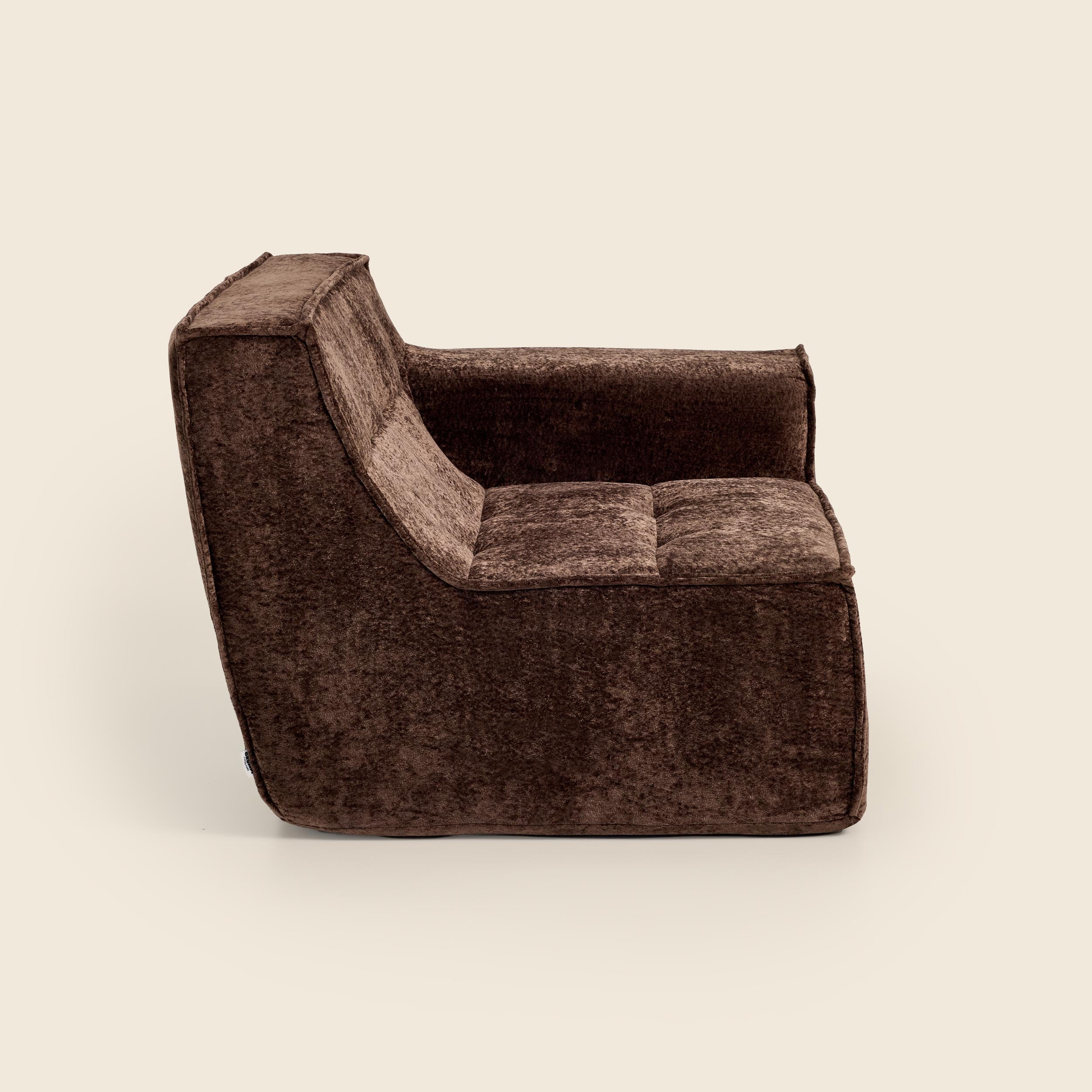 Brown textured armchair on a beige background
