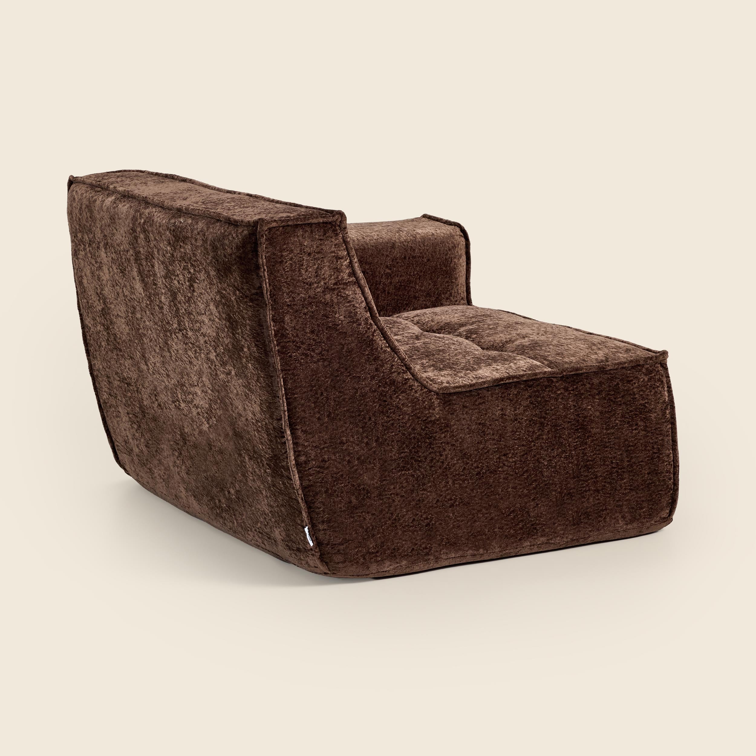 Brown textured armchair on a beige background
