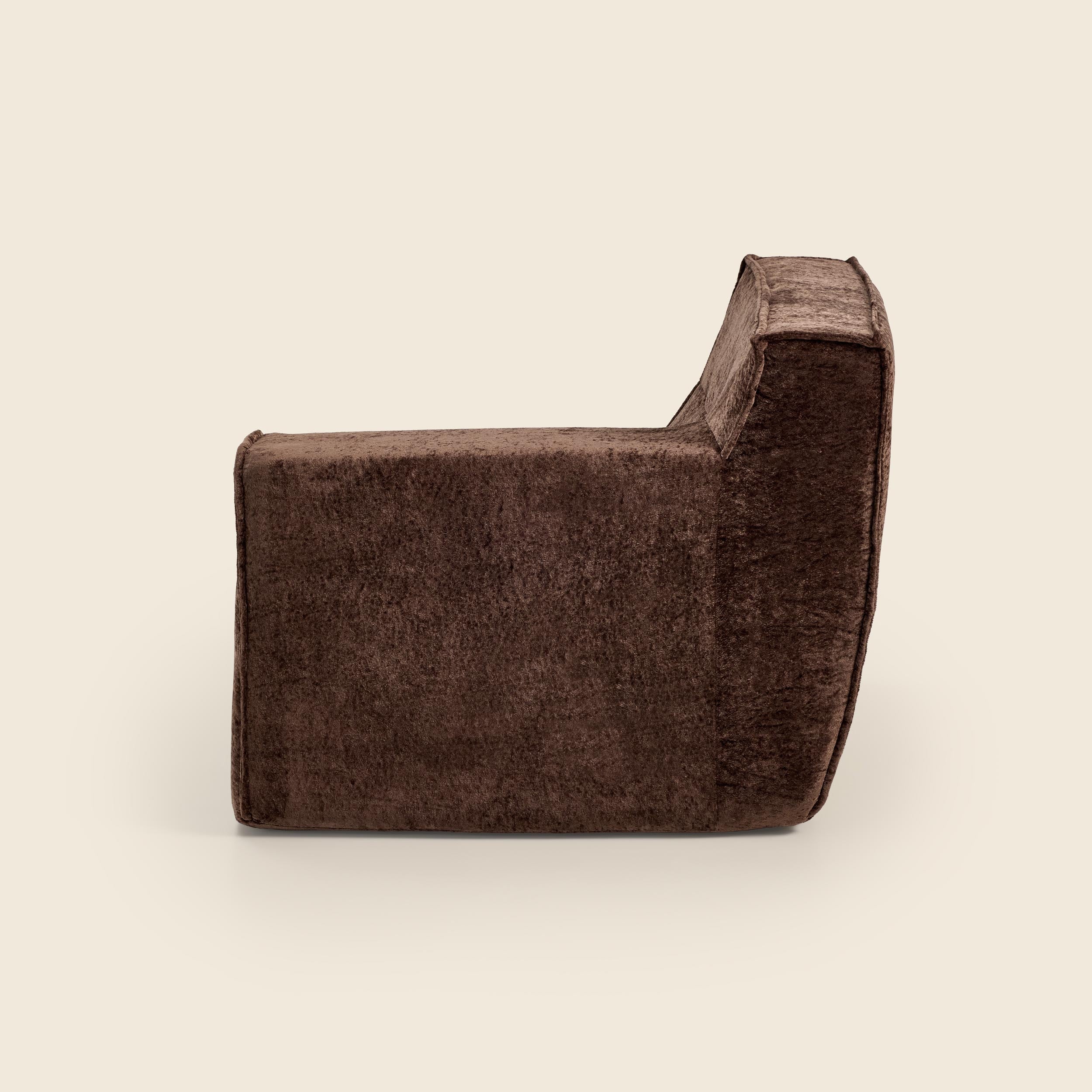 Brown velvet armrest on a beige background
