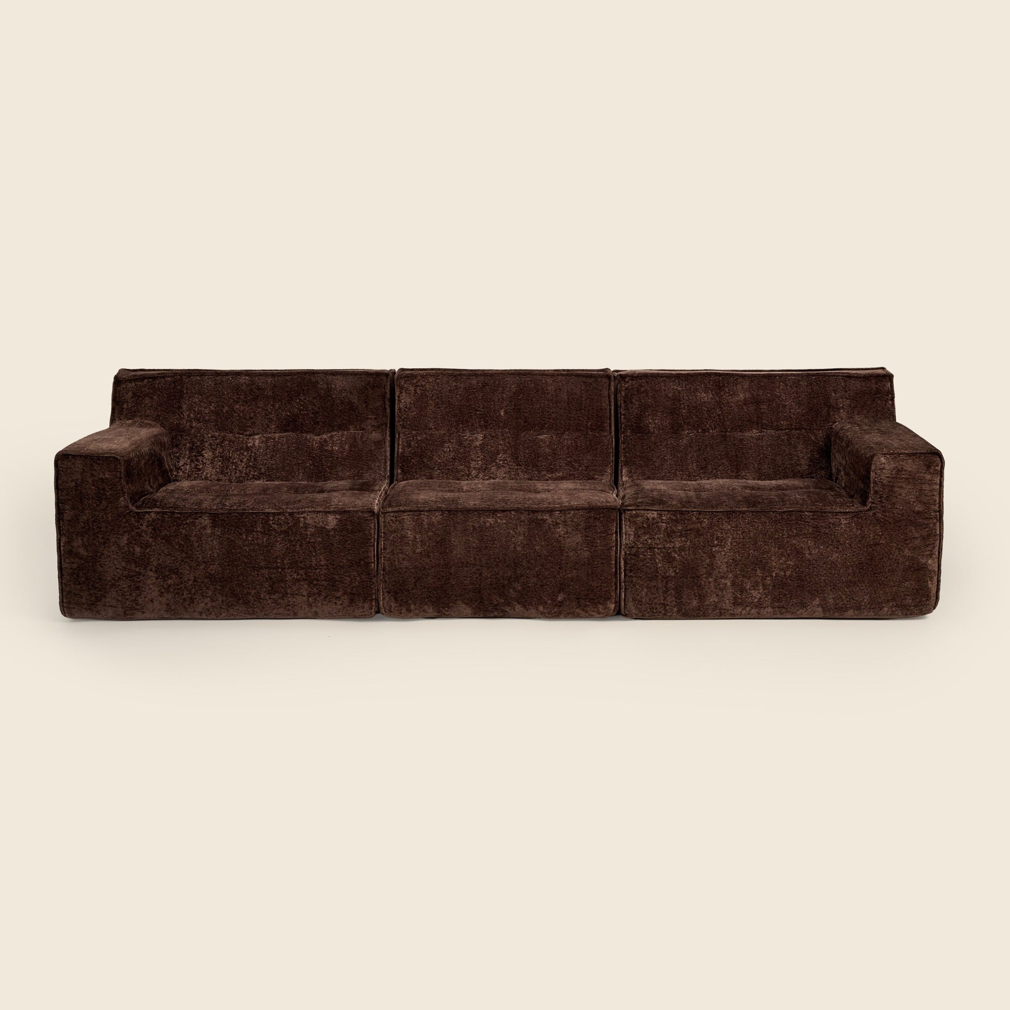 Three piece brown modular lounge, angled view on a beige background 