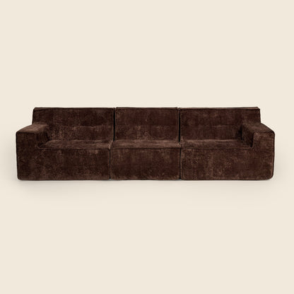Three piece brown modular lounge, angled view on a beige background 