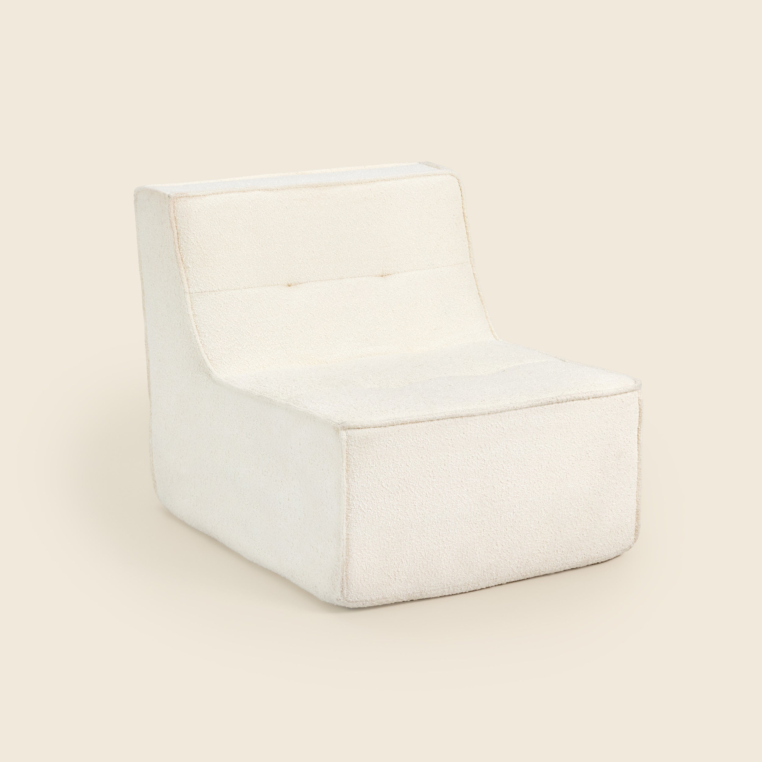 Ivory boucle Loungi modular chair on a beige background 