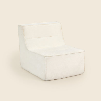 Ivory boucle Loungi modular chair on a beige background 