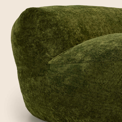 Close up of green textured chair on a beige background 