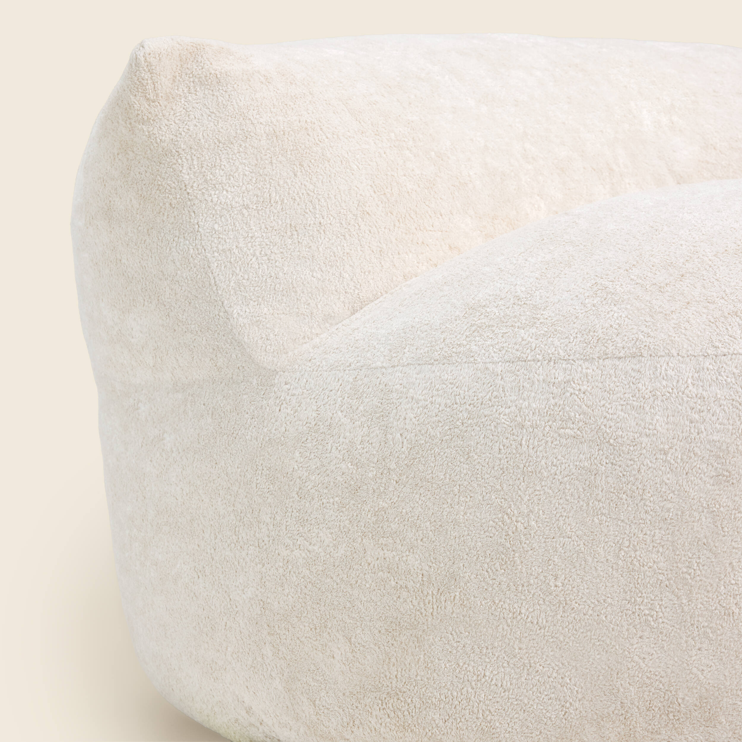 White bean bag chair on a beige background 