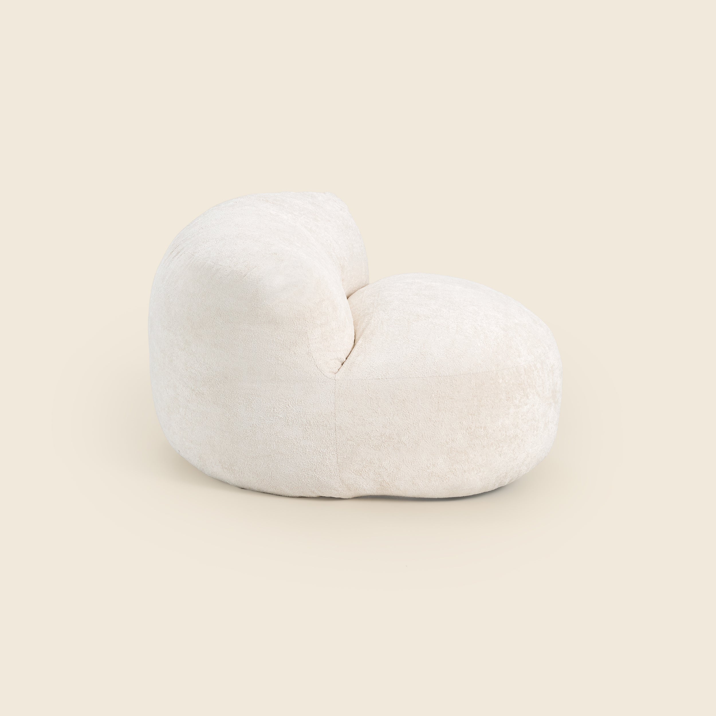 White bean bag chair on a beige background 