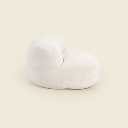 White bean bag chair on a beige background 