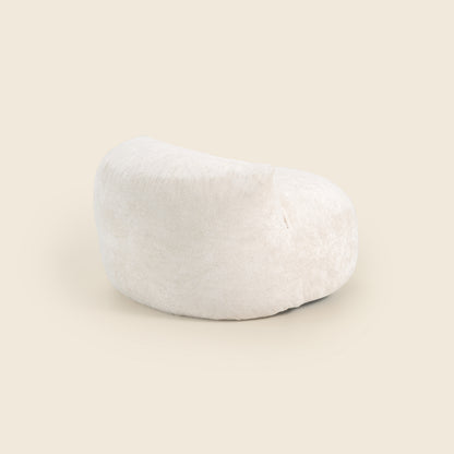 White bean bag chair on a beige background 