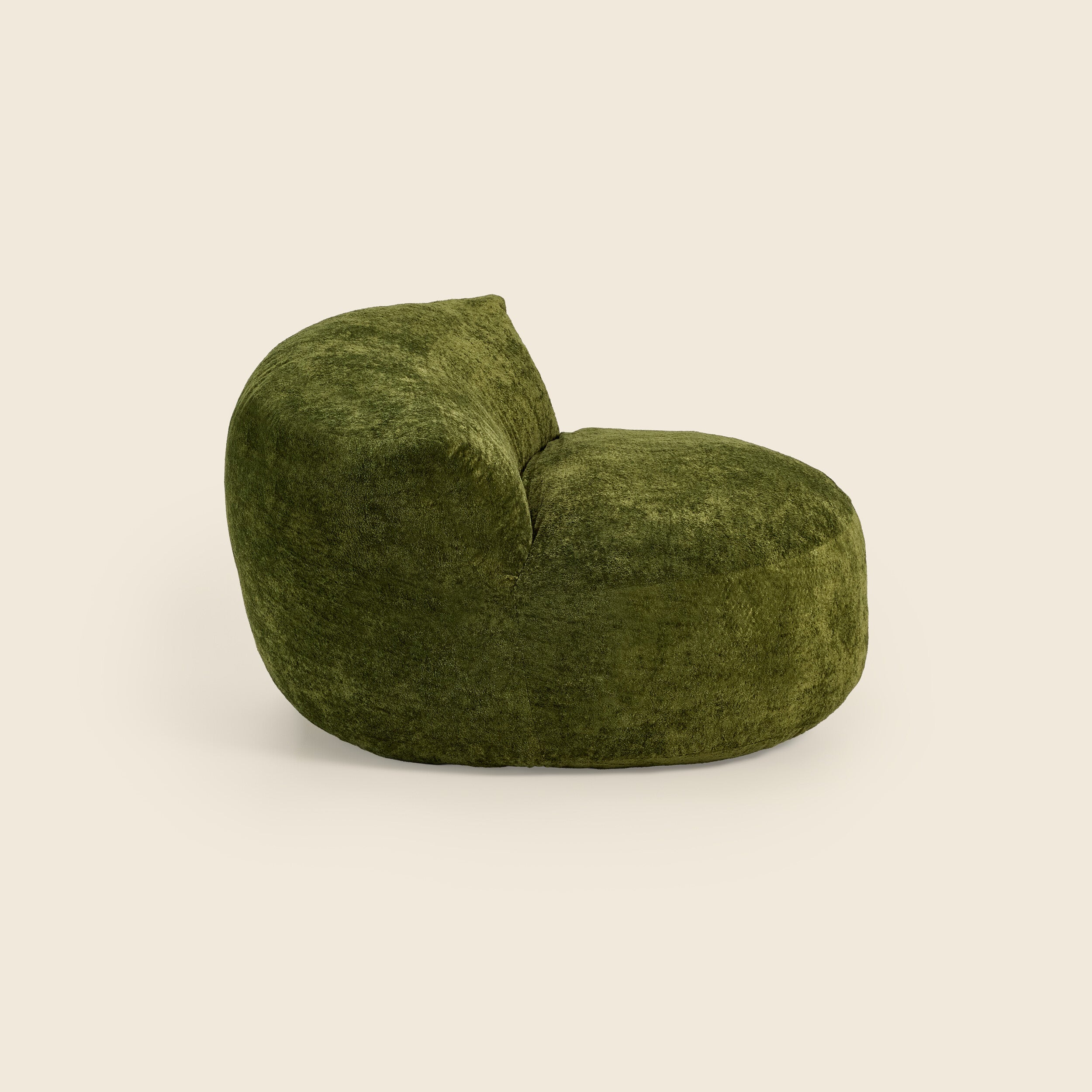 Green textured chair on a beige background 