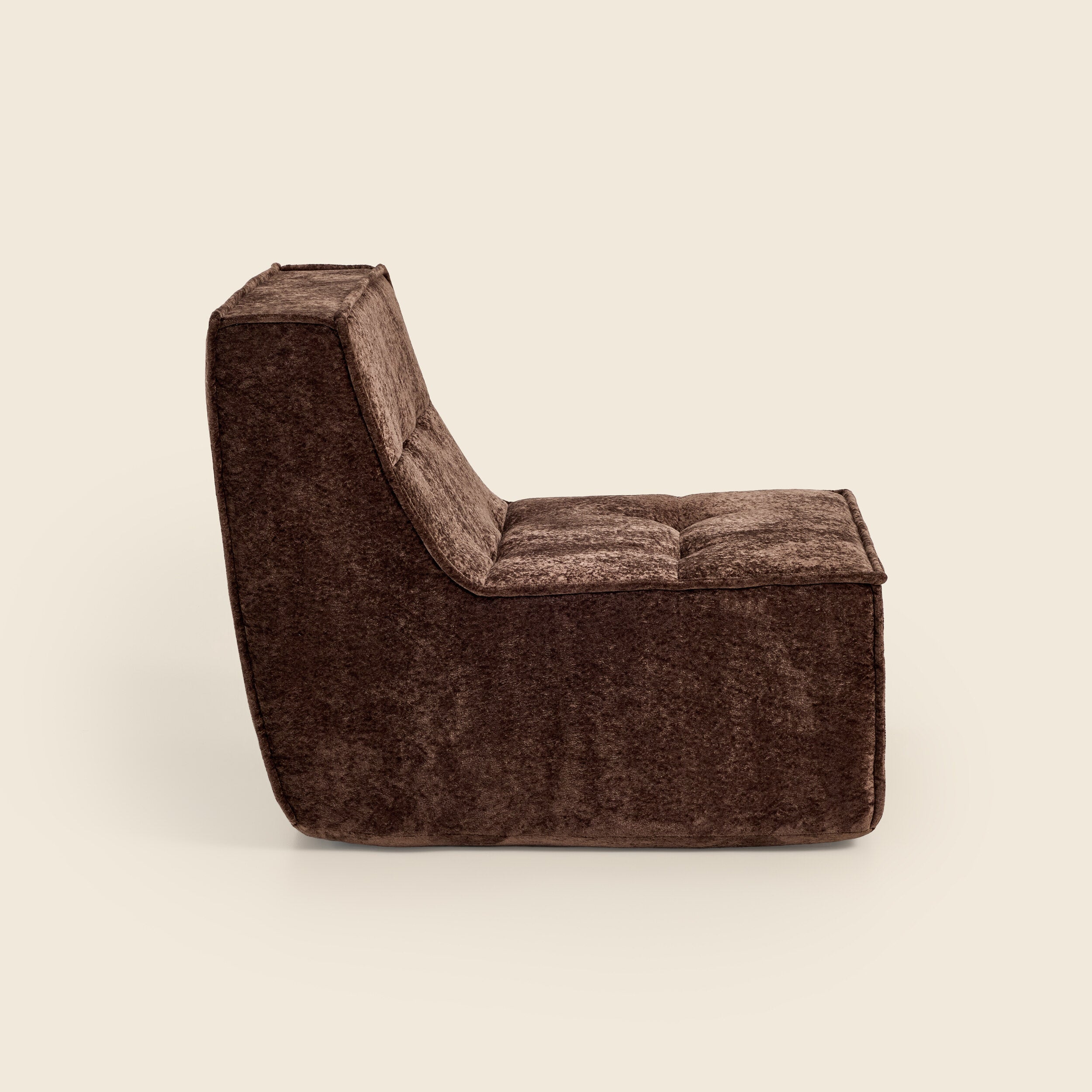 Brown snow velvet Loungi modular chair, side view on a beige background 