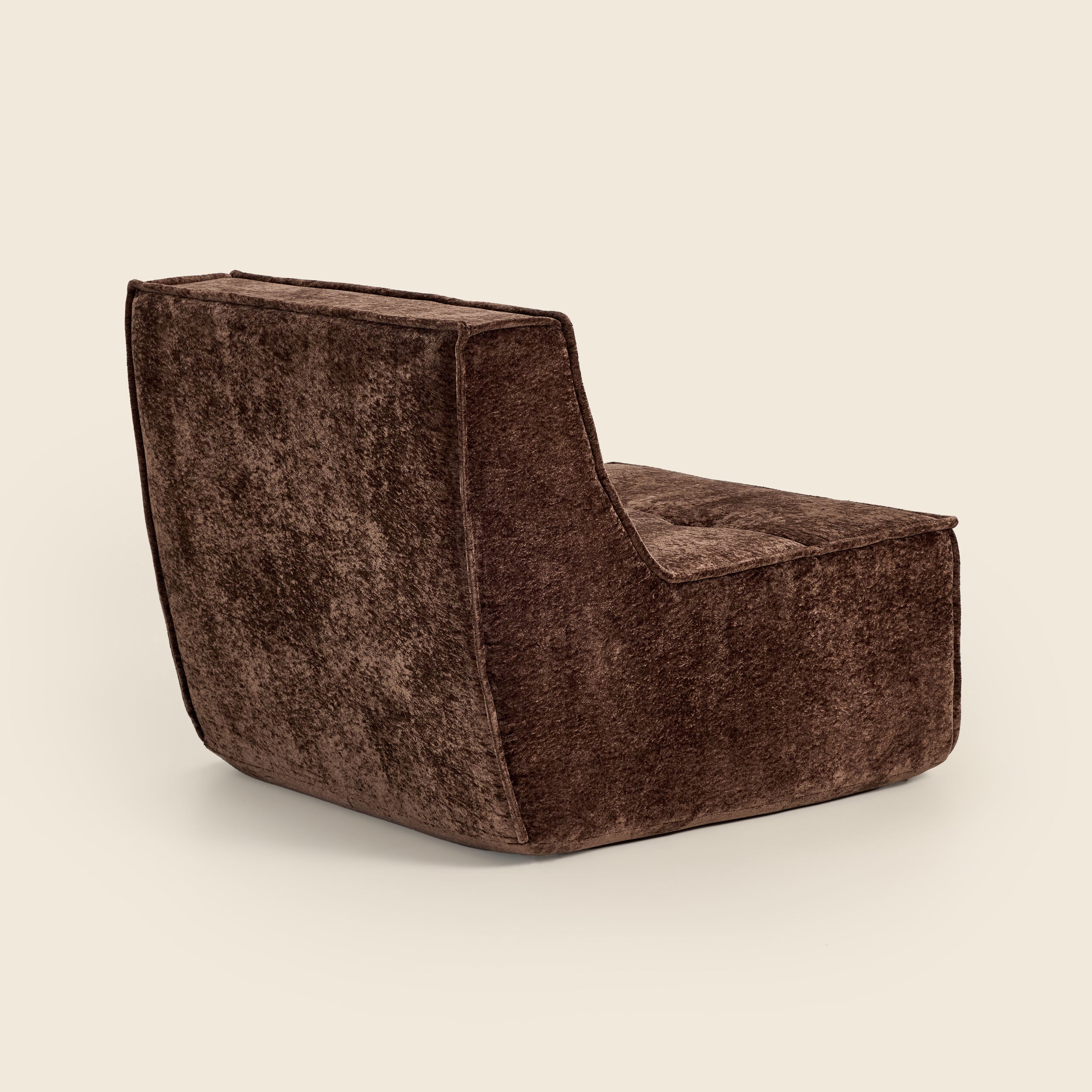 Brown snow velvet Loungi modular chair, back view on a beige background 
