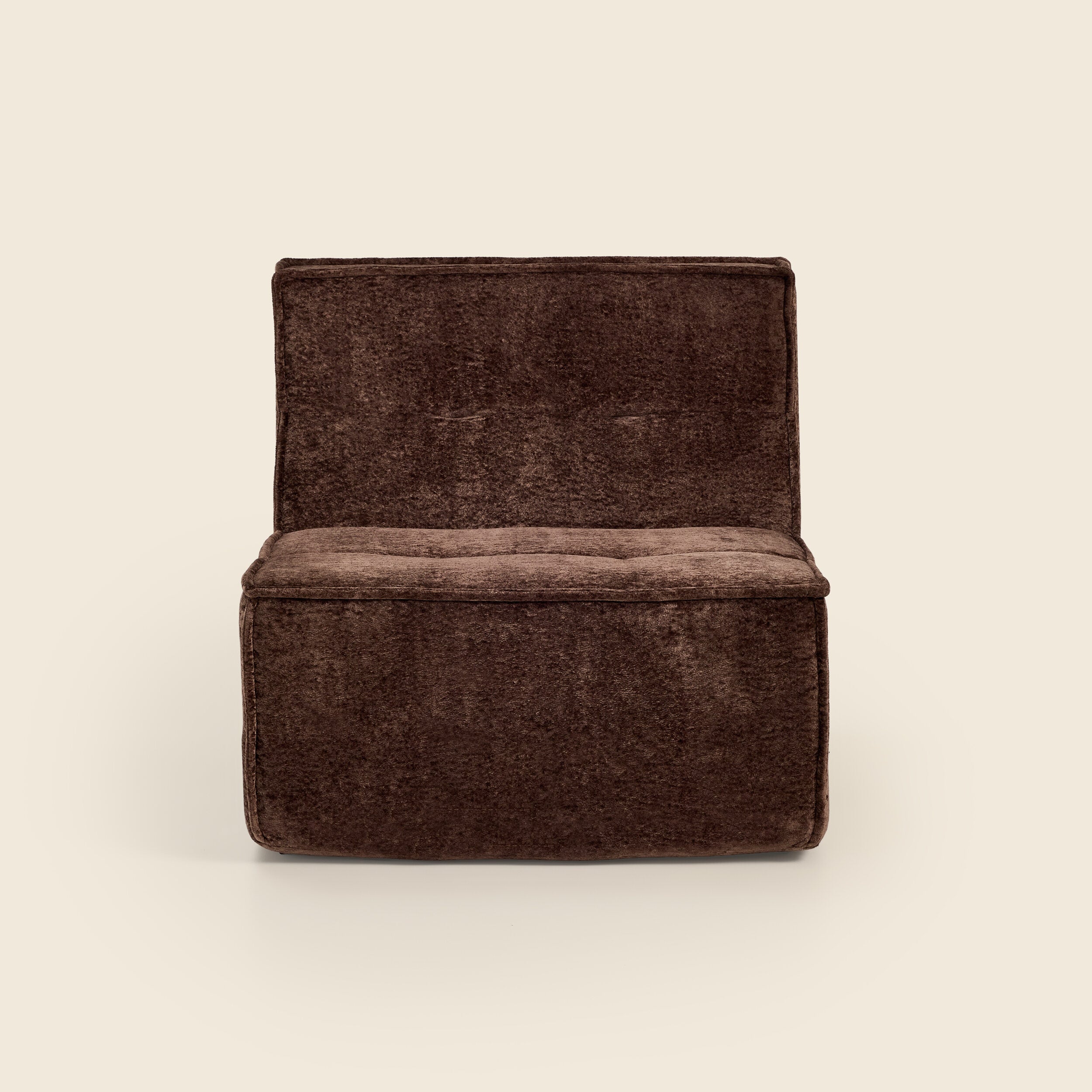 Brown snow velvet Loungi modular chair, angled view on a beige background 