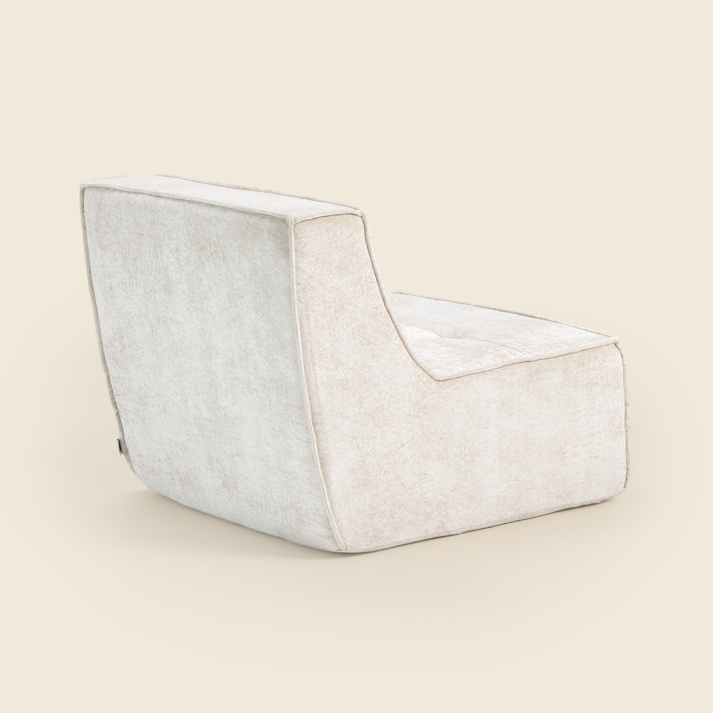 Oat snow velvet Loungi modular chair on a beige background 