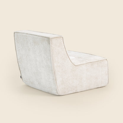 Oat snow velvet Loungi modular chair on a beige background 