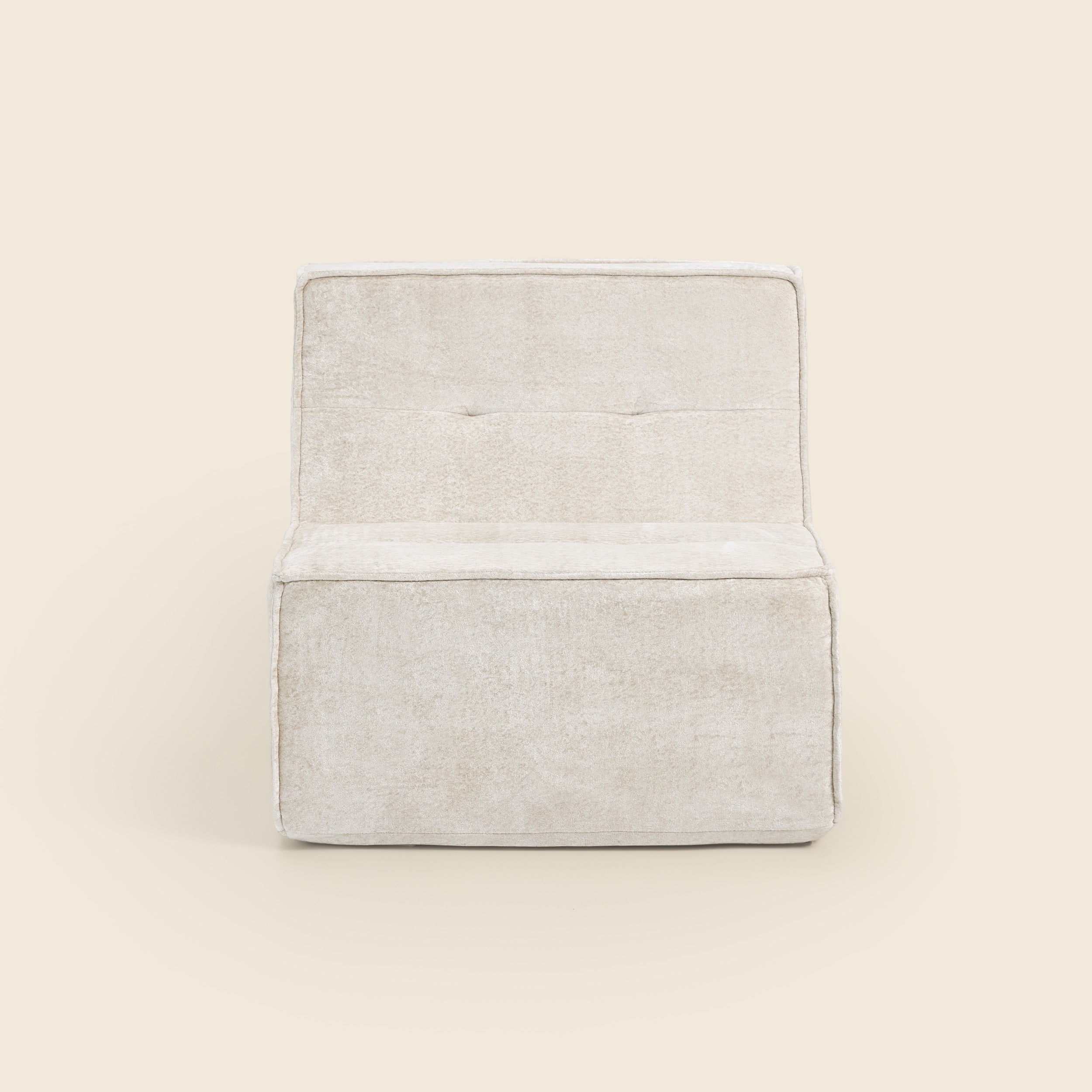 Oat snow velvet Loungi modular chair, angled view on a beige background 