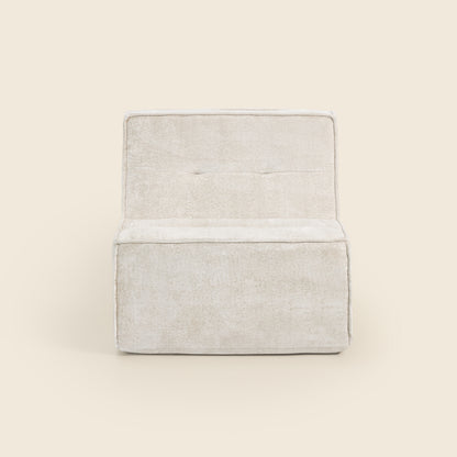 Oat snow velvet Loungi modular chair, angled view on a beige background 