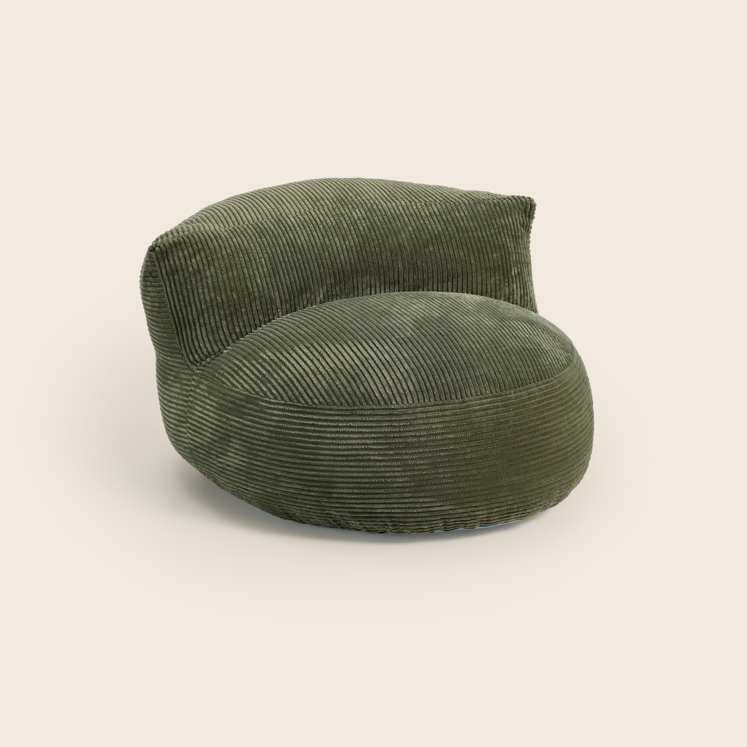Green corduroy armchair on a beige background #color_forest-green-corduroy