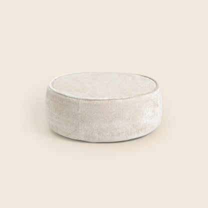 White ottoman on a beige background 