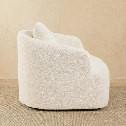 White textured armchair on a beige background 