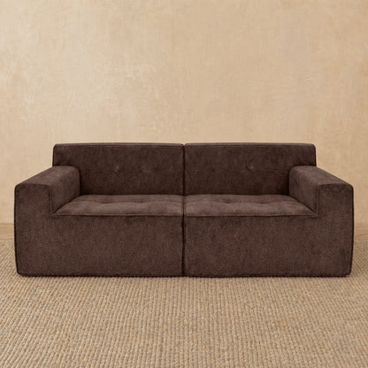Brown sofa against a beige wall #color_2-piece