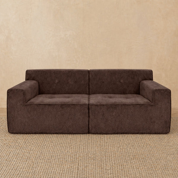 Brown sofa against a beige wall #color_2-piece